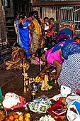 Worship and puja offerings inside the Swamimalai temple.